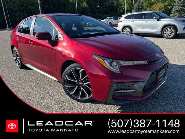 2022 Toyota Corolla SE in Ruby Flare Pearl — front three-quarter view